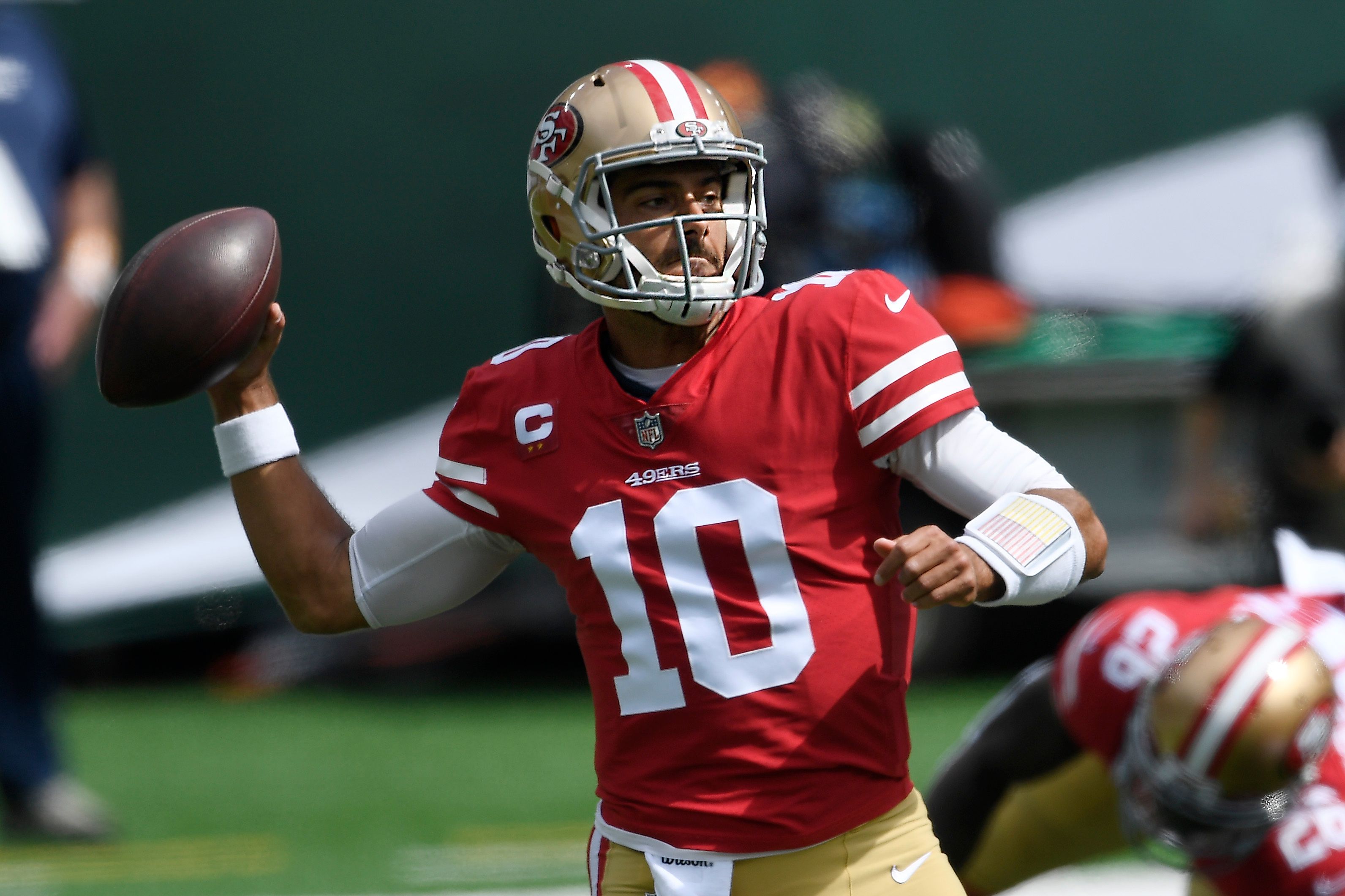 Jimmy Garoppolo throws a pass in an NFL game.