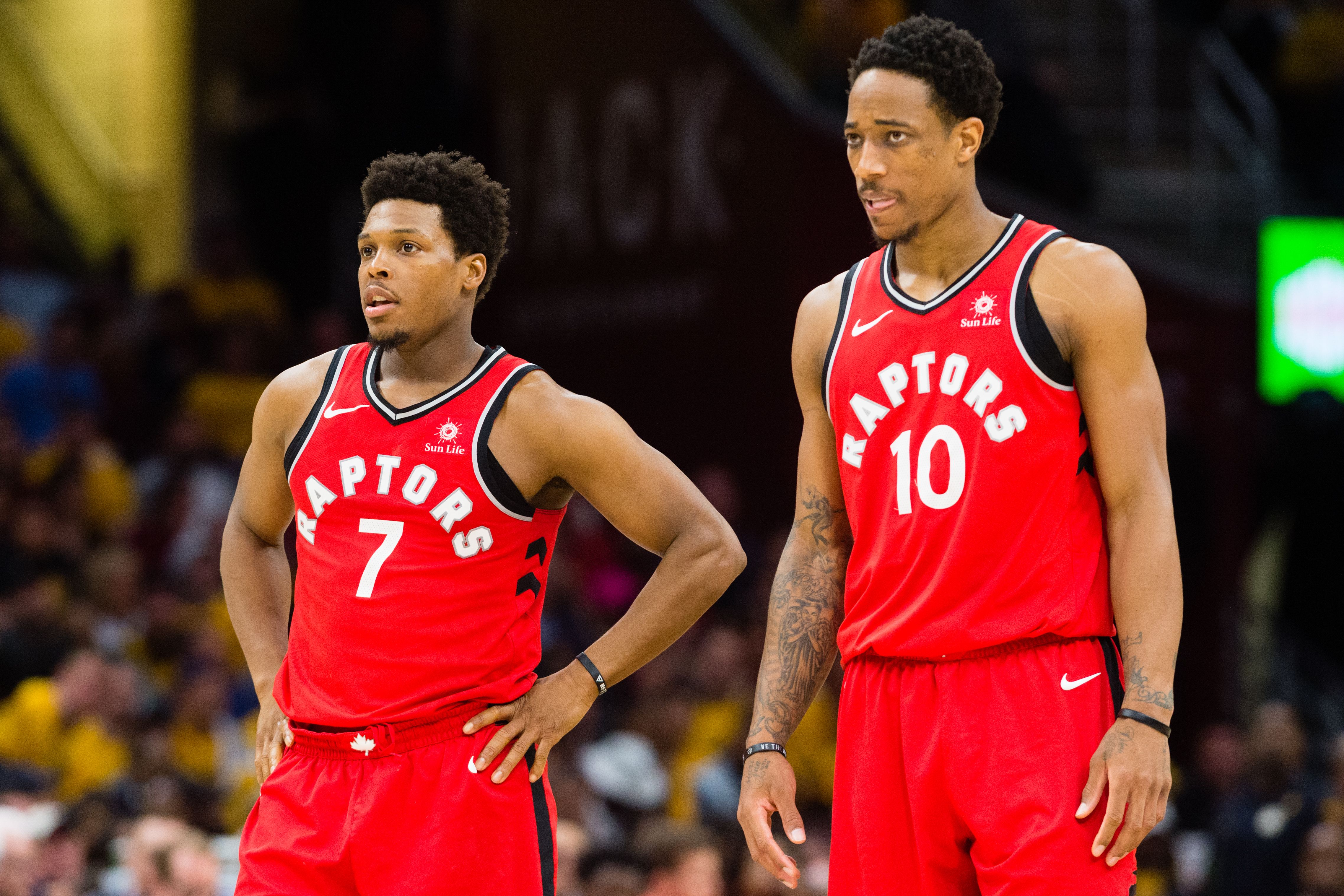 Kyle Lowry and DeMar DeRozan waiting for the ref's decision