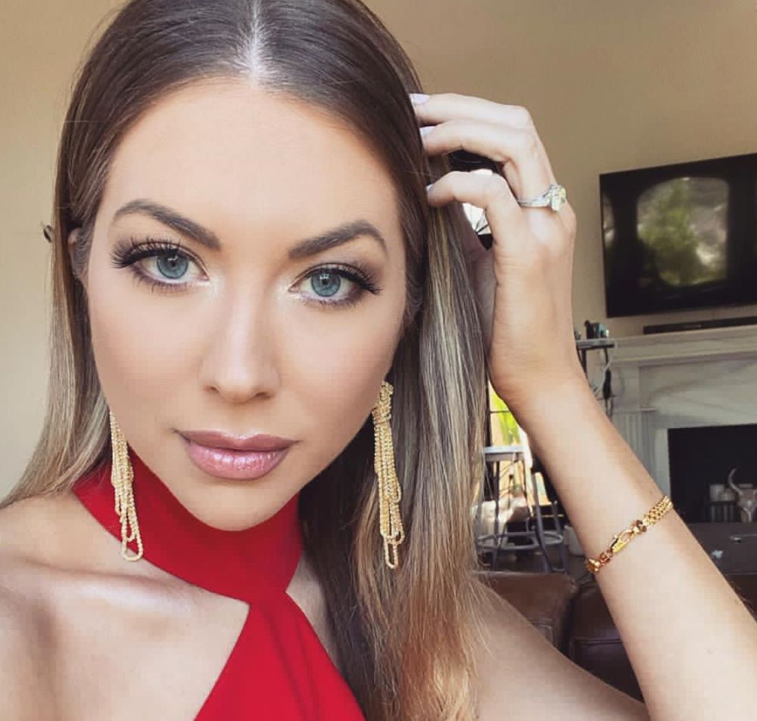 Stacey Schroeder appears in a red dress at the reunion of 'Vanderpump Rules'.
