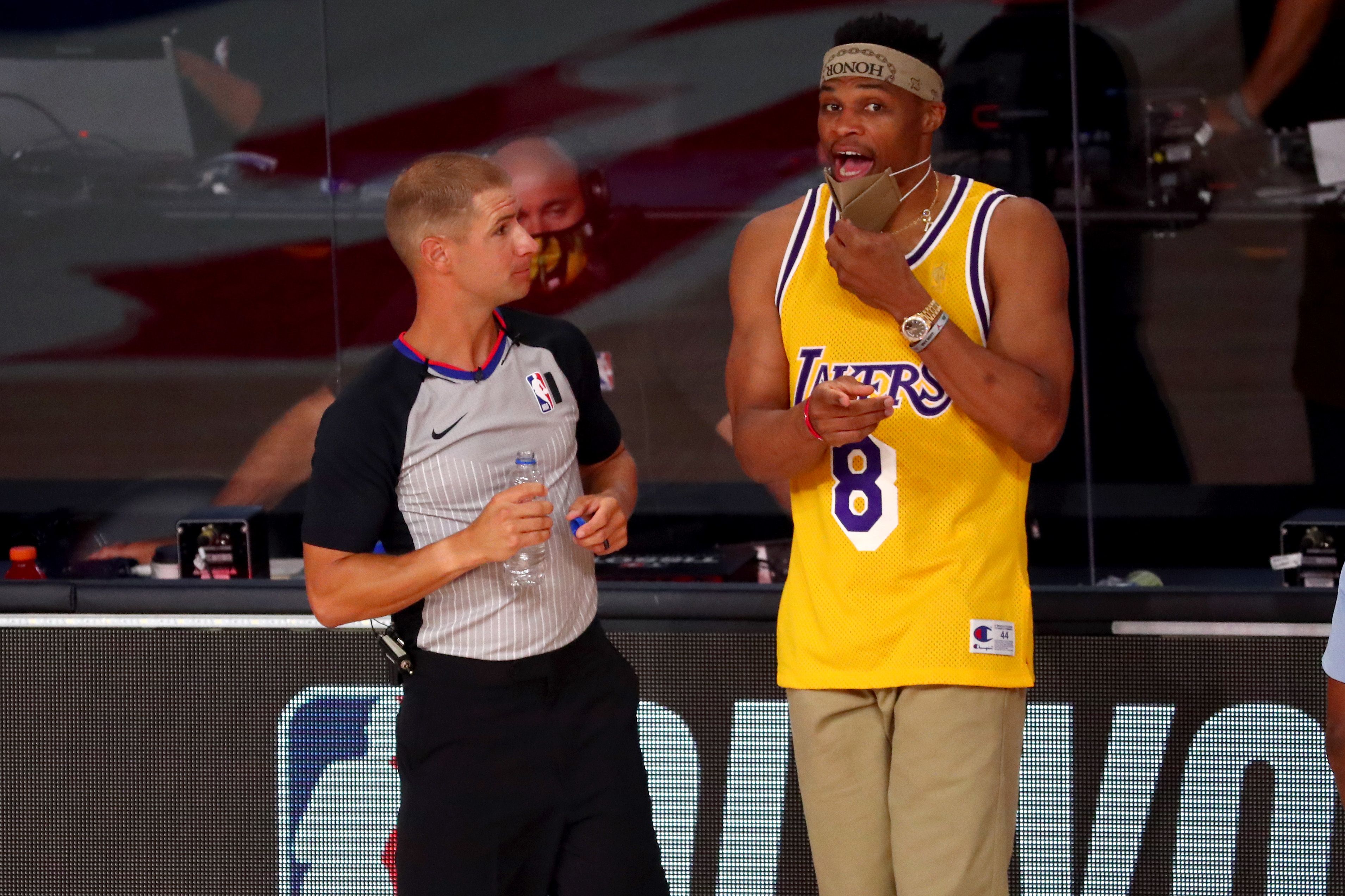 Russell Westbrook wearing Lakers' jersey while talking to the referee