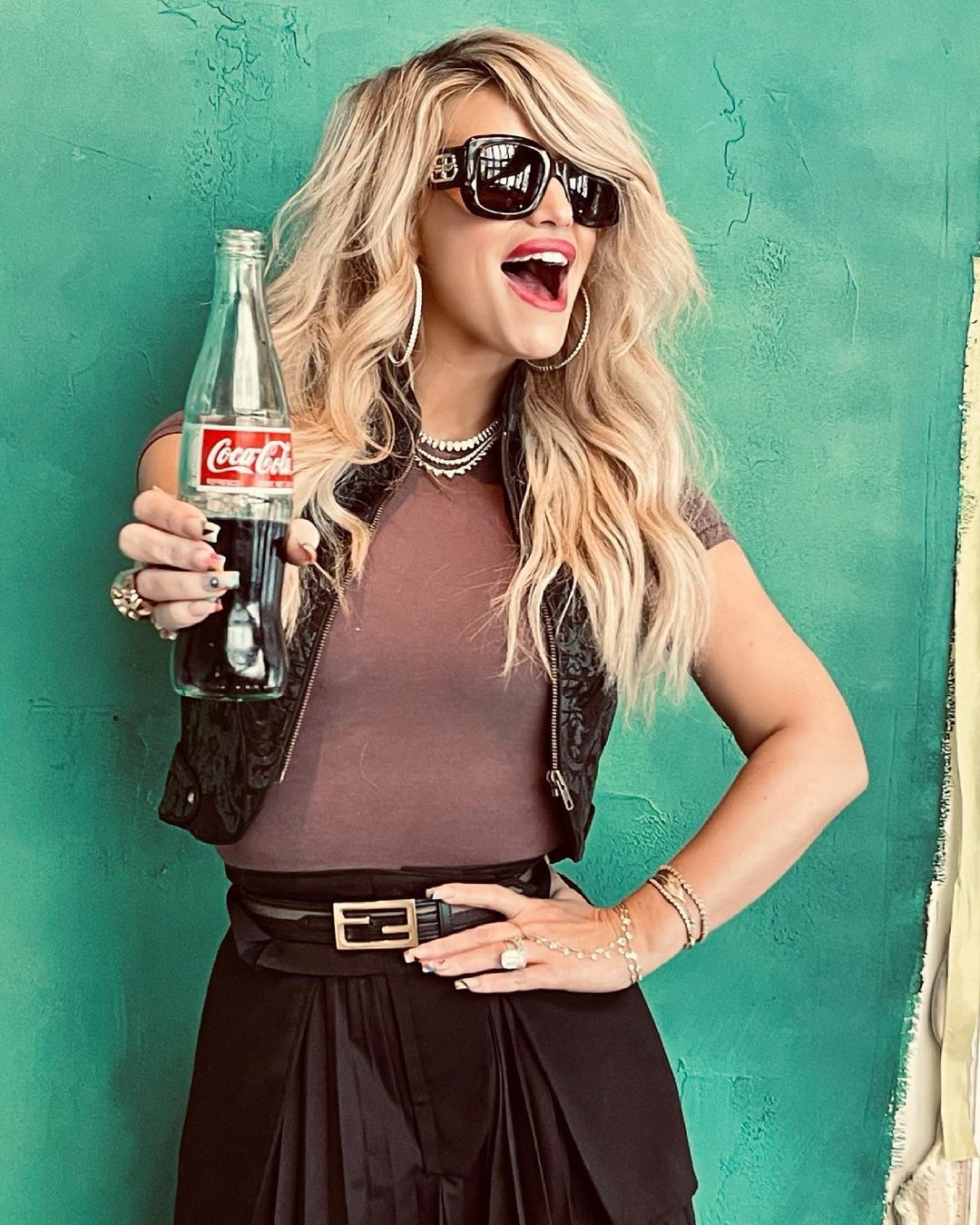 Jessica Simpson holding a coke bottle