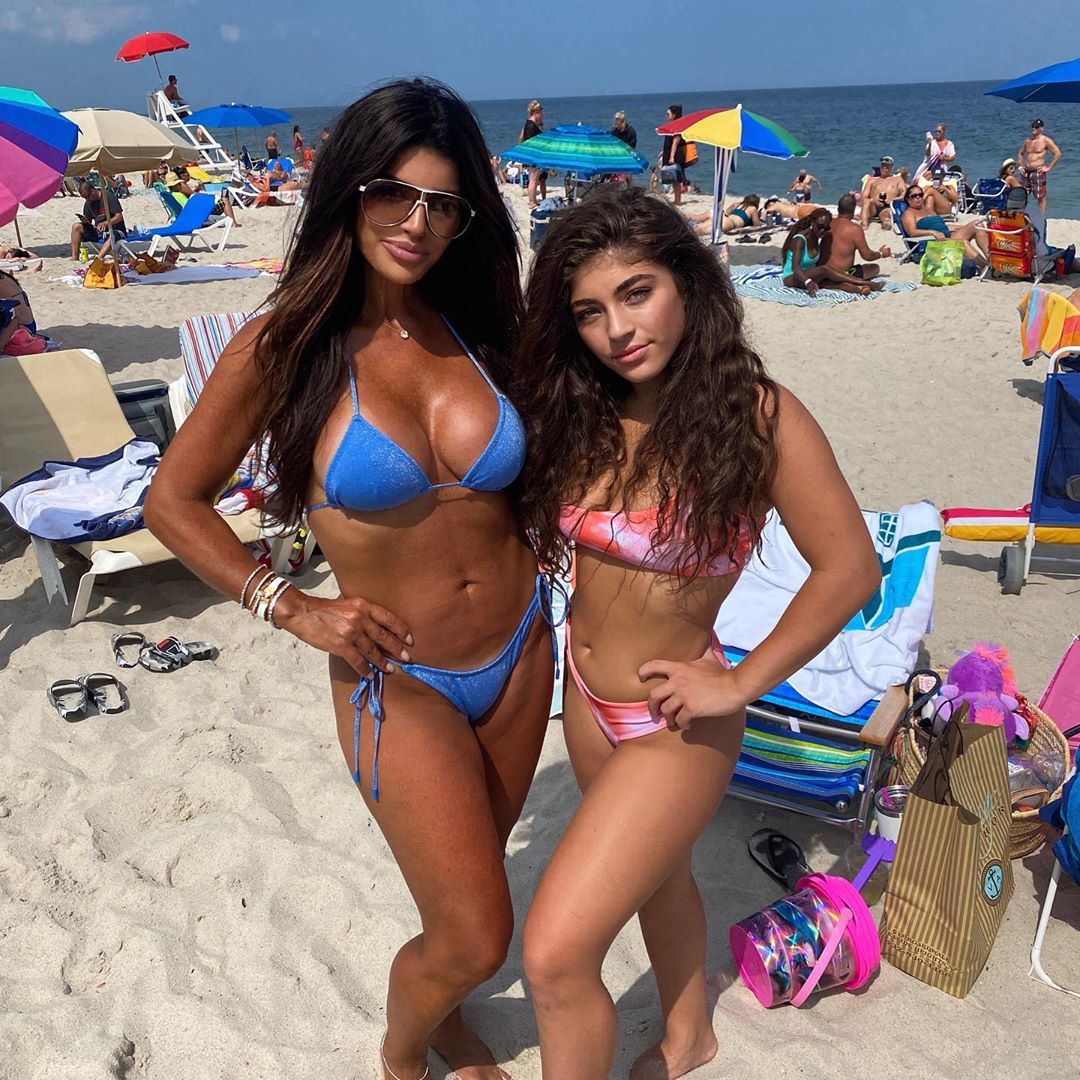 Teresa Giudice posing on the beach with her daughter. 