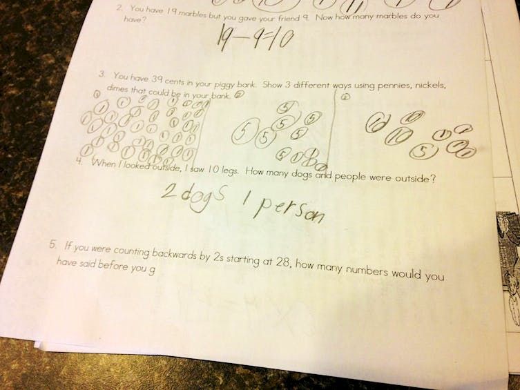 One photo of student's answer of two dogs and one person 