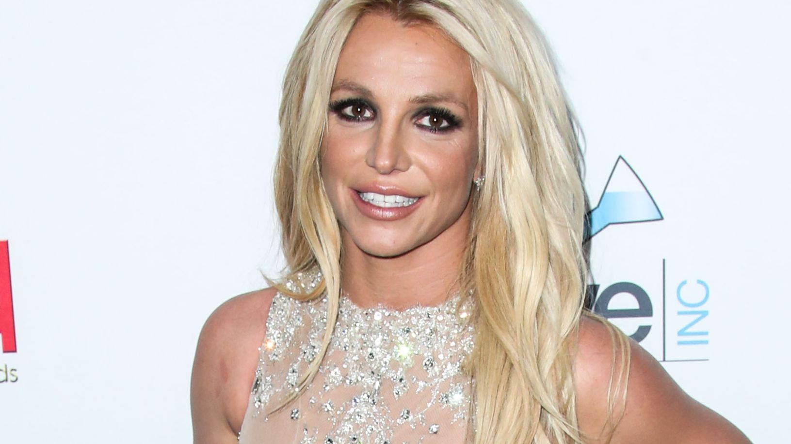 Britney Spears Spreads Legs, Arches Back In String Bikini